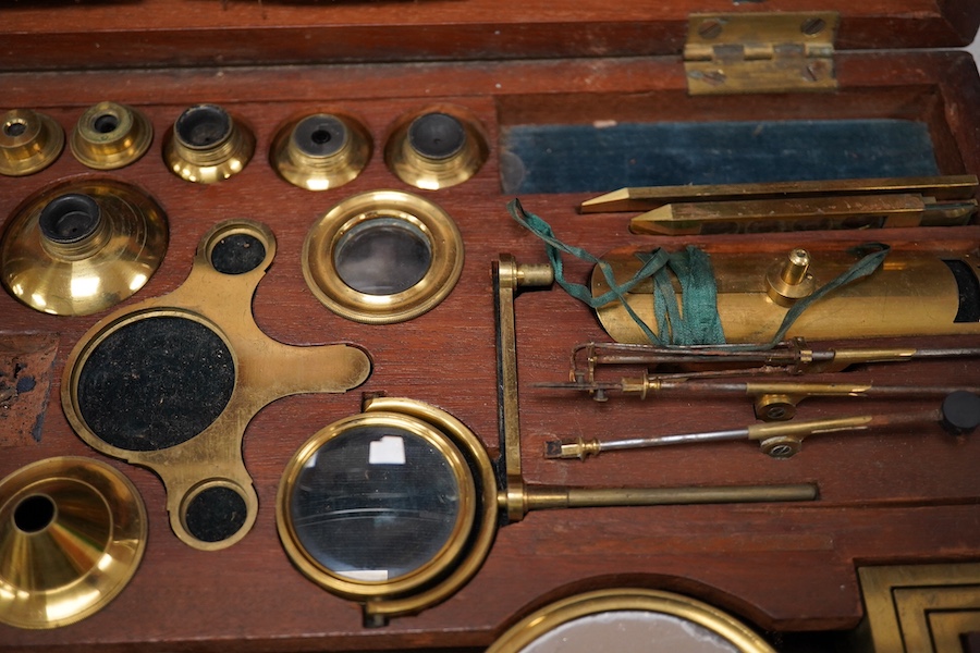 A mid 19th century folding compound and simple monocular microscope by William Harris & Co. 50 High Holborn, London, in its fitted mahogany case with paper maker’s label to inside of the lid. Condition - fair to good, so